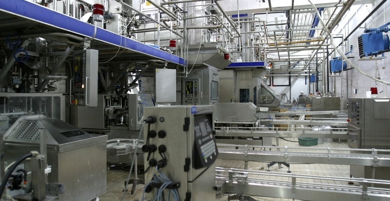 stainless steel temperature control valves and pipes in modern dairy